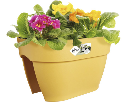 Gele balkonbak met kleurrijke primula''s