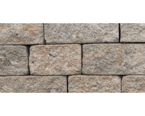 Close-up van een muur van beige straatstenen