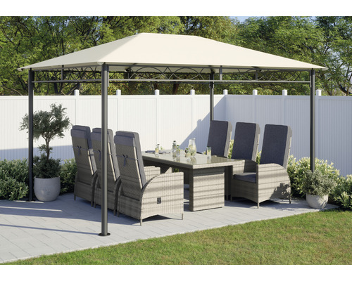 Paviljoen met eettafel en stoelen in de tuin.