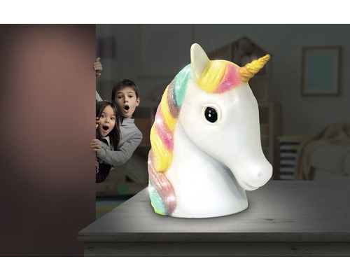 Eenhoornlamp als tafellamp met kinderen op de achtergrond