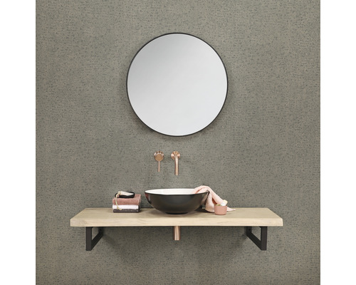 Badkamer met ronde spiegel, opzetwastafel, wastafelblad en kranen