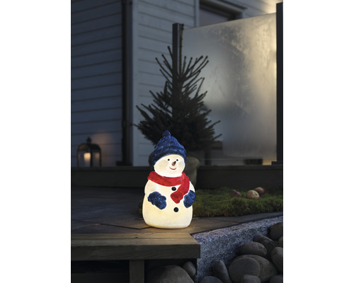 Verlichte sneeuwpop als decoratie voor buiten