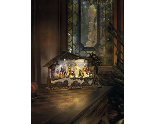 Kerststal met figuren en stal op een tafel