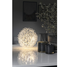 Decoratief LED lichtobject in bolvorm op een tafel