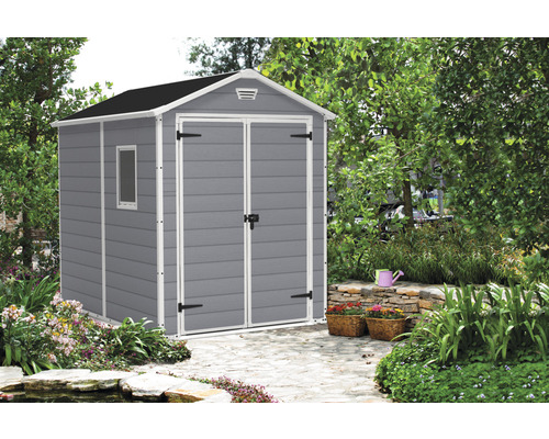 Kunststof tuinhuis met raam en dubbele deur in de tuin