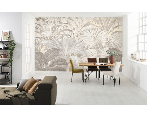 Woonkamer met fotobehang met plantenmotief, eettafel en bank