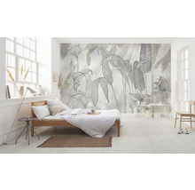 Lichte slaapkamer met een bed en een fotobehang met plantmotieven