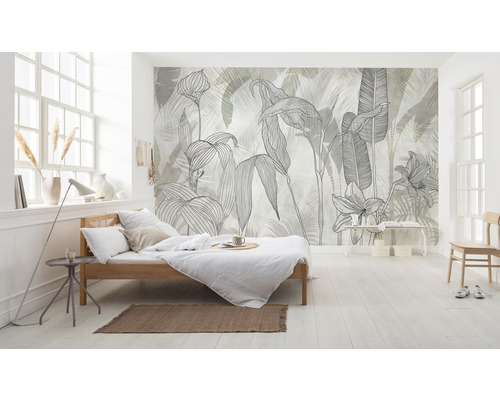 Lichte slaapkamer met een bed en een fotobehang met plantmotieven