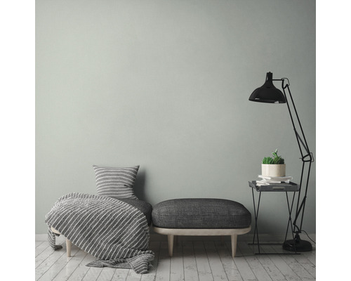 Interieur met zitmeubel, deken, kussen, lamp en bijzettafel