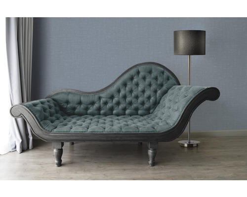 Chaise longue met knoopsluiting en vloerlamp