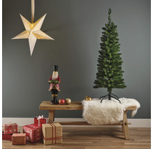 Kerstscène met kunstboom, notenkrakerfiguur, cadeaus en sterlamp