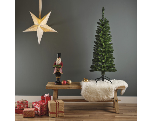 Kerstscène met kunstboom, notenkrakerfiguur, cadeaus en sterlamp