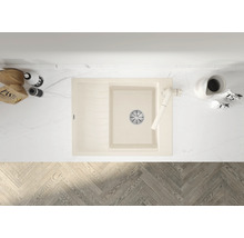 Afbeelding van een beige gootsteen met afdruiprek