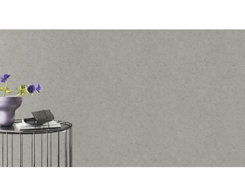 Close-up van een grijs betonbehang in het interieur.