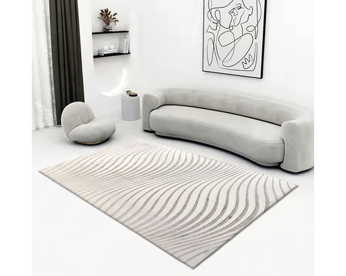 Woonkamer met vloerkleed met golfpatroon, bank en fauteuil