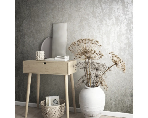 Decoratief interieur met console, vaas en droogbloemen voor een gestructureerd behang.