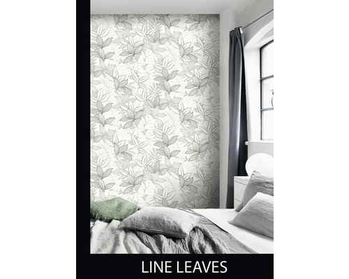 Slaapkamer met behang met bladdessin