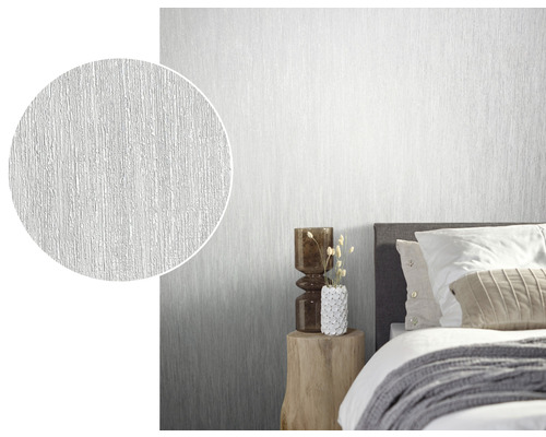 Slaapkamer met wit structuurbehang en close-up van de behangstructuur