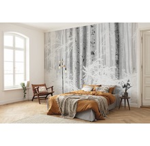 Slaapkamer met fotobehang winterbos, bed en houten vloer