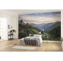 Slaapkamer met fotobehang van een berglandschap