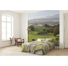 Slaapkamer met fotobehang van een heuvellandschap met bergen