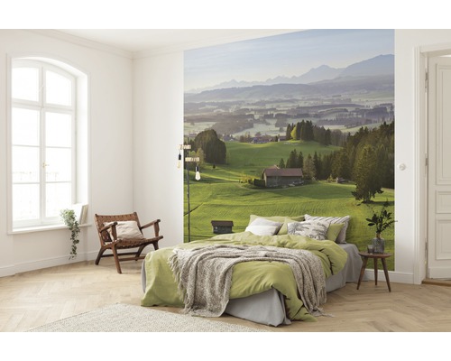 Slaapkamer met fotobehang van een heuvellandschap met bergen