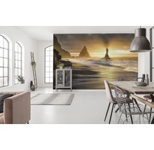Woonkamer met fotobehang van een strandmotief bij zonsopgang