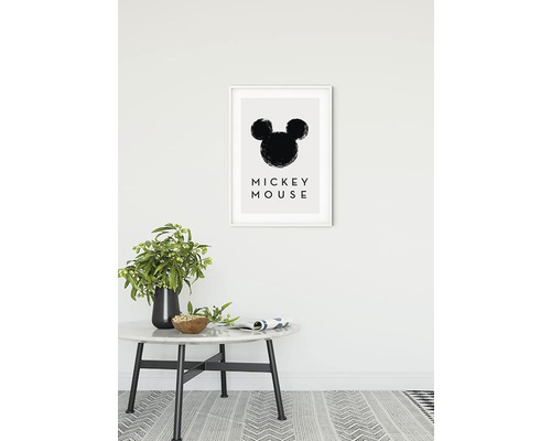 Decoratieve afbeelding met silhouet van Mickey Mouse in een lijst aan een muur