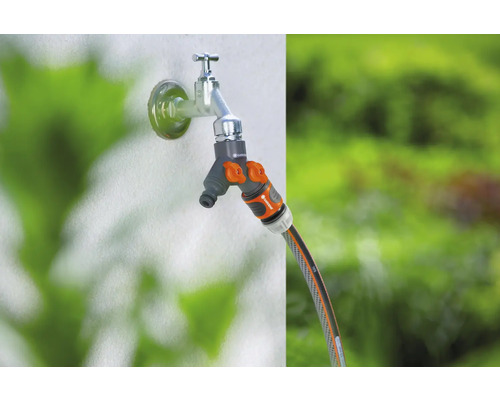 Waterkraan met verdeler en tuinslang