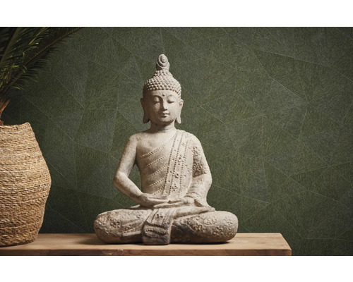 Boeddhabeeld van steen op een tafel