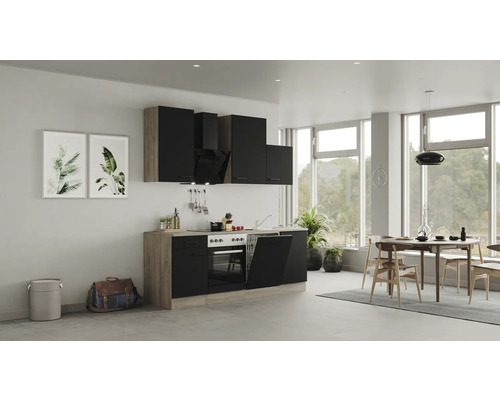 Moderne keuken met zwarte kasten, eettafel en stoelen in een heldere ruimte.