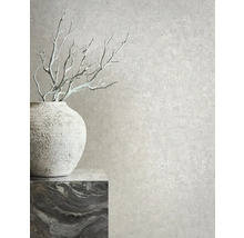 Decoratief behang met stucwerk textuur en vaas met takken