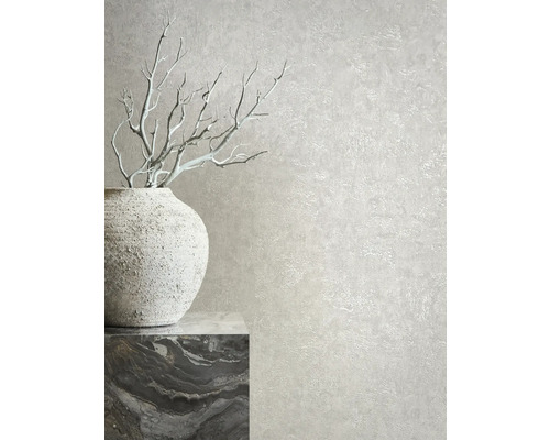 Decoratief behang met stucwerk textuur en vaas met takken