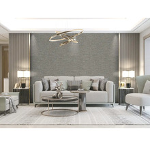 Lichte woonkamer met bank, salontafel en decoratief wandbehang