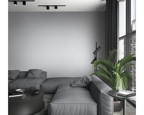Woonkamer met modulaire bank, vloerlamp en railspots