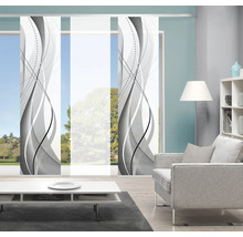 Woonkamer met schuifpanelen met golfpatroon als raamdecoratie