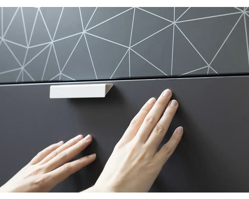 Meubeldetail met handgreep en geometrisch patroon