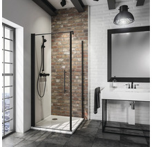 Moderne badkamer met douche, wastafel en spiegel in een ruimte met bakstenen muur.