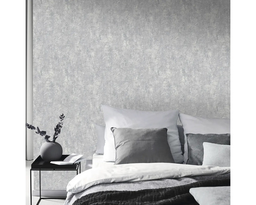 Slaapkamer met gestructureerd behang in steenlook