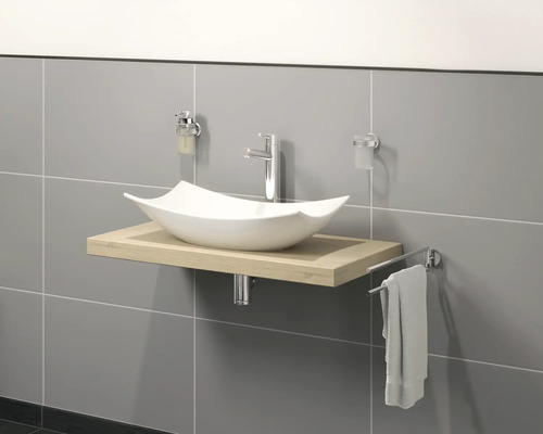 Wastafel met opzetwastafel, kraan en handdoekhouder in de badkamer