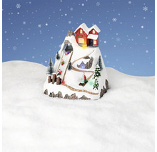 Decoratief winterlandschap met berghut en sleeërs