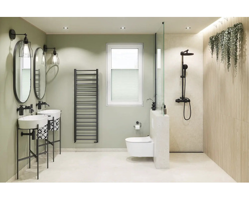 Lichte badkamer met dubbele wastafel, radiator, toilet en douche