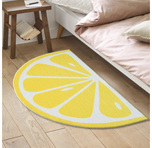 Decoratief vloerkleed in citroenpartdesign in de slaapkamer