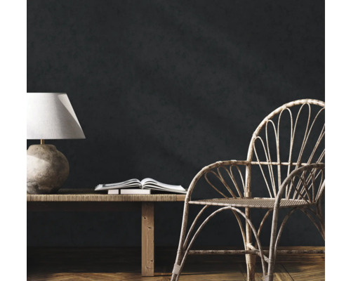 Kamerinterieur met tafellamp, boek, bank en stoel