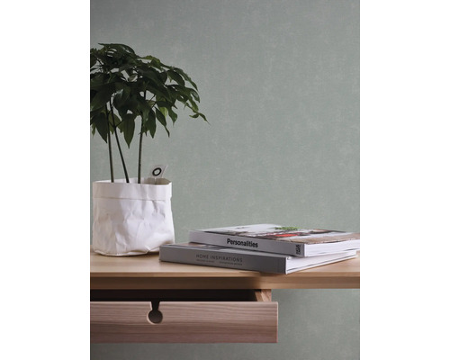 Decoratief stilleven met plant, boeken en tafel