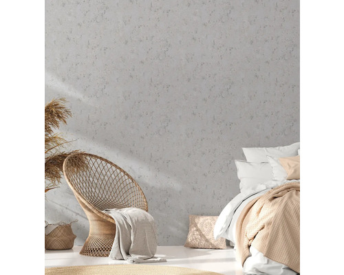 Slaapkamer met rotan meubels, bed en decoratieve muur