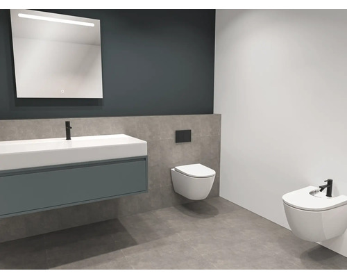 Moderne badkamer met wastafel, spiegel met verlichting, wandcloset en bidet.