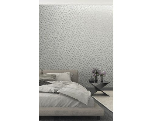 Slaapkamer met geometrisch behang, bed en nachtkastje