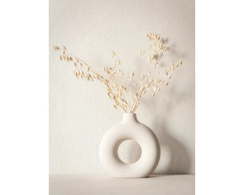 Decoratieve vaas met gat en gedroogde grassen