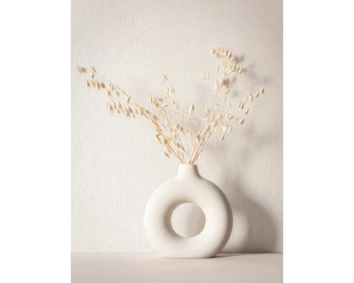 Decoratieve droogbloemen in een ronde vaas met opening
